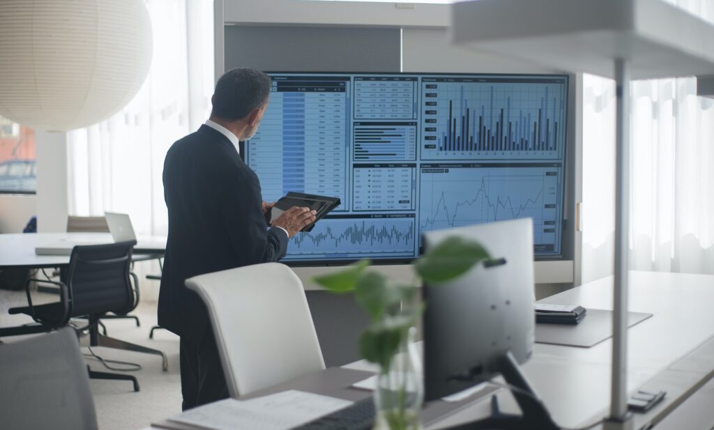 https://www.pexels.com/photo/man-looking-at-a-screen-with-stock-market-data-8353793/